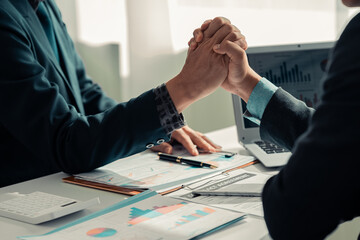 Business people shake hands, end meeting, greet each other with a handshake in the office, end...
