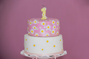 Delicate pink cake for 1st birthday with charming decoration