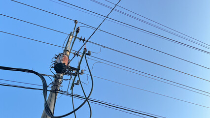 electric pole with a transformer or power stabilizer in the middle