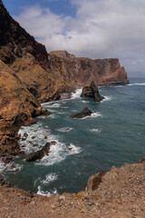 Steep coastal cliffs with rocky ocean inlet. Madeira