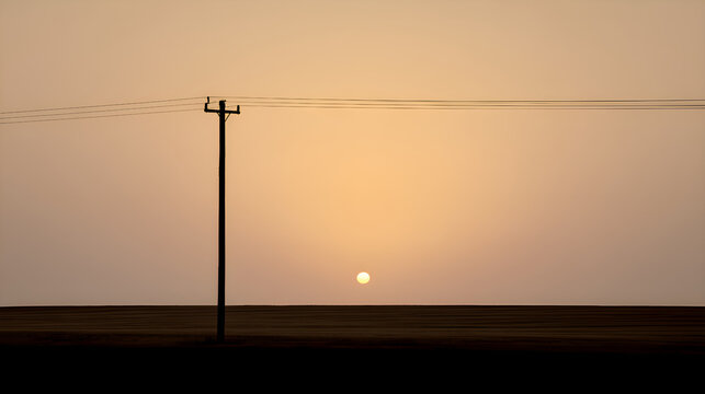 Serene sunset behind rural power lines