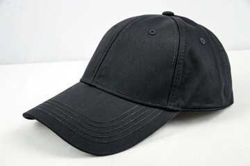 The perfect dark-colored baseball cap, with clear stitching details, for a street fashion or sports theme.