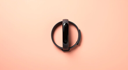 Dark fitness tracker on peach background smart band