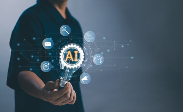 Artificial intelligence AI, chat bot concept,Man holding light bulb with gears and smart robot technology show use of future technology to help work or analyze data improve efficiency of work process