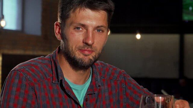 Mature man joyfully sipping beer at the bar - Powered by Adobe