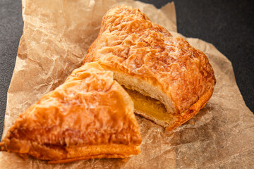 Triangle cake almond puff pastry sweet dessert fresh delicious gourmet food background on the table rustic food top view copy space