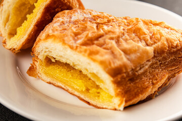 Triangle cake almond puff pastry sweet dessert fresh delicious gourmet food background on the table rustic food top view copy space