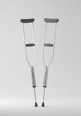 Pair of Silver Crutches Standing on White Background for Accessibility Aid