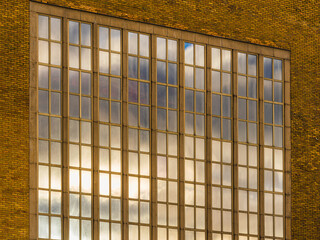 Modern windows facade reflecting clouds in a building in Gothenburg Sweden during the day
