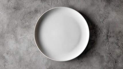 High quality photo of ceramic plate resting on textured gray surface background.