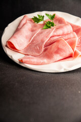 Ham slices meat spam pork fresh delicious gourmet food background on the table rustic food top view...