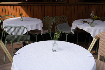 Charming Outdoor Caf Setting with Green Chairs