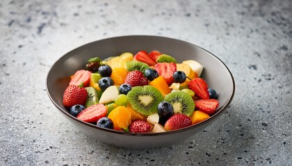 colorful fruit salad spread on terrazzo surface