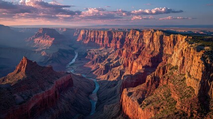 A breathtaking view of a rugged canyon with dramatic cliffs and a winding river, illuminated by soft sunlight under a colorful sky.