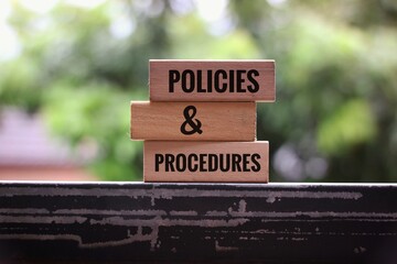 Policies and Procedures Concept Depicted on Wooden Blocks in Business Context
