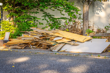 Bulk garbage day concept, miscellaneous rubbish items put on a street for council bulk waste...