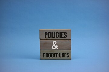 Policies and Procedures Blocks on blue Background Displaying Professional Concept
