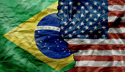 US and Brazilian flags on a cracked background. Political and economic conflict between Brazil and...
