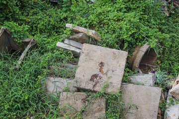Concrete base plates scattered on ground, used in supporting scaffold system