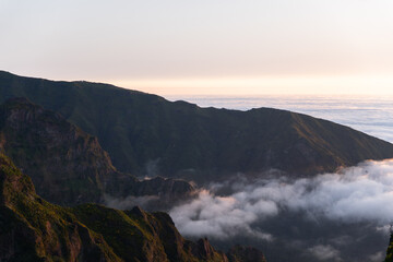 Mountain peaks with drifting clouds Horizontal