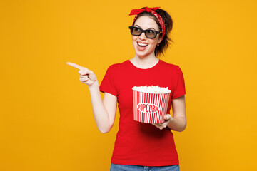 Young smiling happy woman she wear red t-shirt casual clothes 3d glasses watch movie film hold...