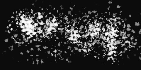 White snowflakes on a black background surface. Macro nature pattern backdrop. Snow overlay background isolated on black. Winter concept. scratches and cracks which can be used as a background.