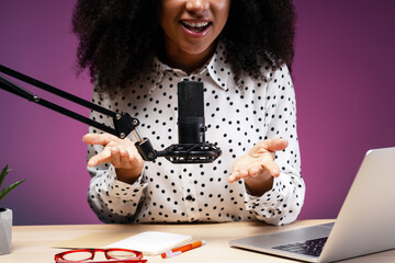 Radio host speaking with enthusiasm during live podcast recording selective focus
