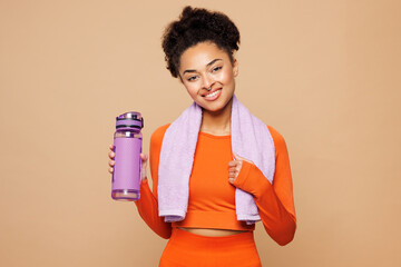 Young strong fitness trainer instructor sporty woman sportsman wearing orange clothes spend time in...