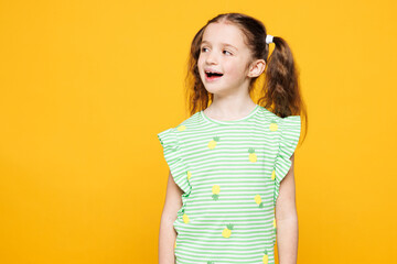 Little toothy shocked surprised cheery cute kid child girl 8-9 years old wears green t-shirt look...