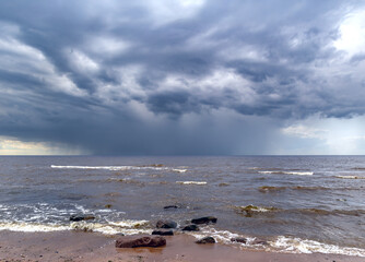 The unusual landscape of Saulkrasti wild beach on Baltic sea shore is formed by large boulders that cover the coast and stately pines growing in the dunes. Latvia