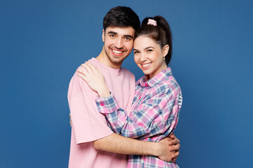 Side profile view young happy couple two friends family man woman they wearing pink casual clothes...