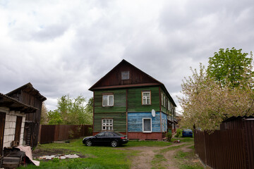 Wooden old barrack-type house, old housing in a big city