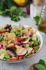 A bowl with Fattoush - Traditional Levantine salad	