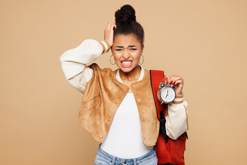 Young sad shocked upset dissatisfied girl student wear casual clothes backpack bag hold in hand...