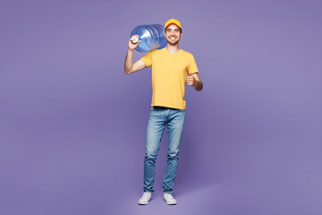 Full body young delivery guy employee man wear yellow cap t-shirt uniform workwear work as dealer...