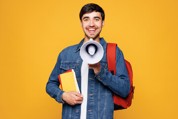 Young boy student he wear denim casual clothes backpack bag hold books megaphone scream announces...