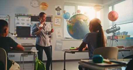 Science Lesson: Female Teacher Educating Smart Kids Using Model of Planet Earth. Primary School Children Studying Renewable Energy and Solar System in Modern Multiethnic Classroom. STEM Education. - Powered by Adobe