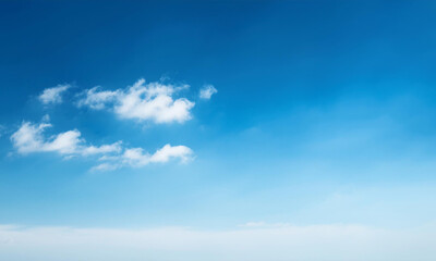 Bright morning sky with gentle layers of cirrus clouds forming artistic patterns against a vibrant blue canvas, perfect for backgrounds, travel inspiration, and environmental tranquility themes