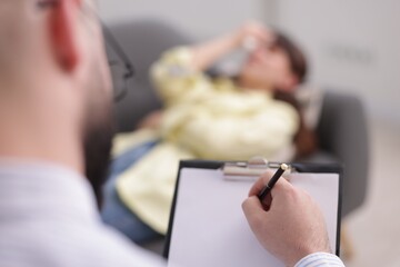 Professional psychologist working with patient in office, selective focus