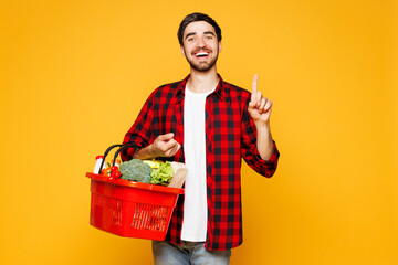 Young man wear casual clothes hold basket bag for takeaway mock up with food products point index...