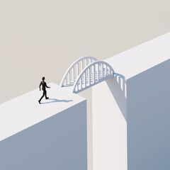 Bridging of a Gap concept. A man in a suit approaching a bridge between to blocks