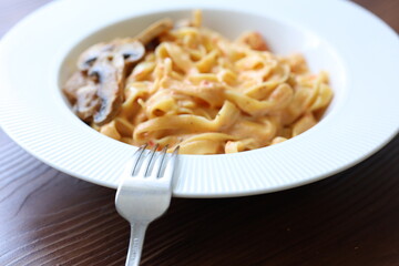 Creamy mushroom and chicken Mediterranean Italian Tagliatelle Pasta close up