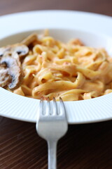 Creamy mushroom and chicken Mediterranean Italian Tagliatelle Pasta close up