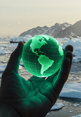Hand holding glowing green globe over melting Arctic ice with polar bears and ships, symbolizing climate change