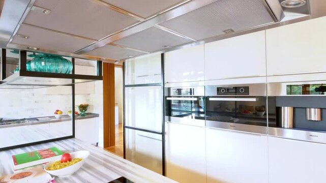 A modern kitchen with sleek white cabinets and stylish design