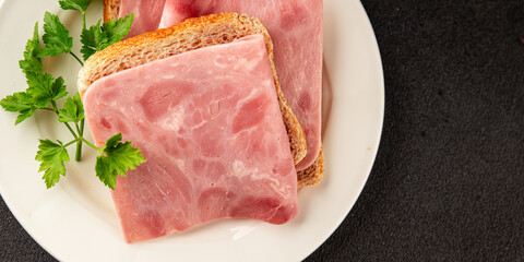 Sandwich ham slices meat spam pork fresh gourmet food background on the table rustic food top view...