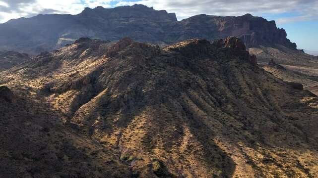 Aerial view of rock formations and mountains in desert, United States.