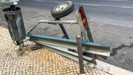 Rustic urban chaos captured in fallen metal frame and wheel, symbolizing anarchic May Day protests...