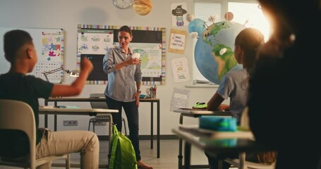 STEM Class: African American School Boy Presenting Renewable Energy Sources Using Model of Planet Earth. Female Teacher Teaching Environmental Science to Elementary School Kids in Modern Classroom. - Powered by Adobe