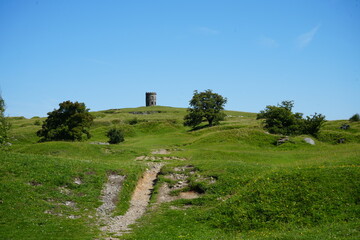 Stone tower overlooking scenic green landscape at Solomon&rsquo;s Temple in Buxton, England